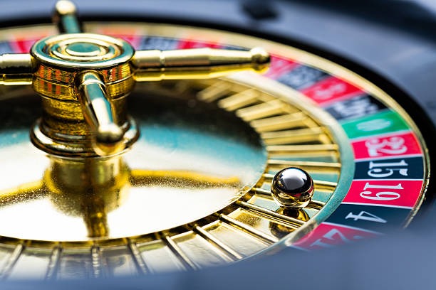 Casino Hold'em dealer revealing community cards on jericho live table